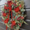 Traditional style faux Christmas wreath with red ranunculus flowers - Image 2